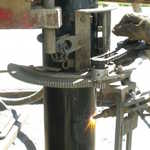 Cutting the last piece of well casing.